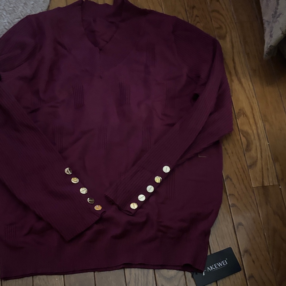 Chic Burgundy V-Neck Sweater with Gold Accents